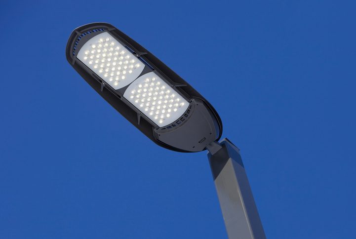 Polk Electric LLC | Illuminated LED Streetlight against a Clear Blue Sky