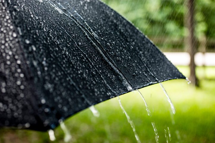 Polk Electric LLC | Rainy day. Raindrops falling on black umbrella outdoors. Spring, summer.
