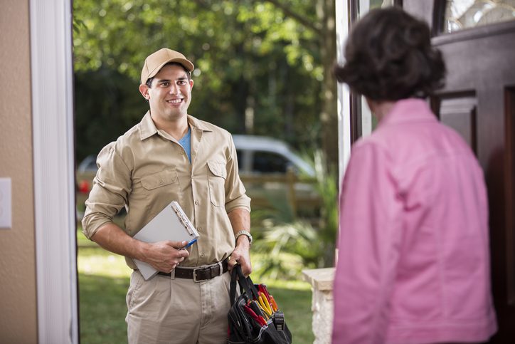 Polk Electric LLC | Service Industry: Latin descent repairman at customer's front door.